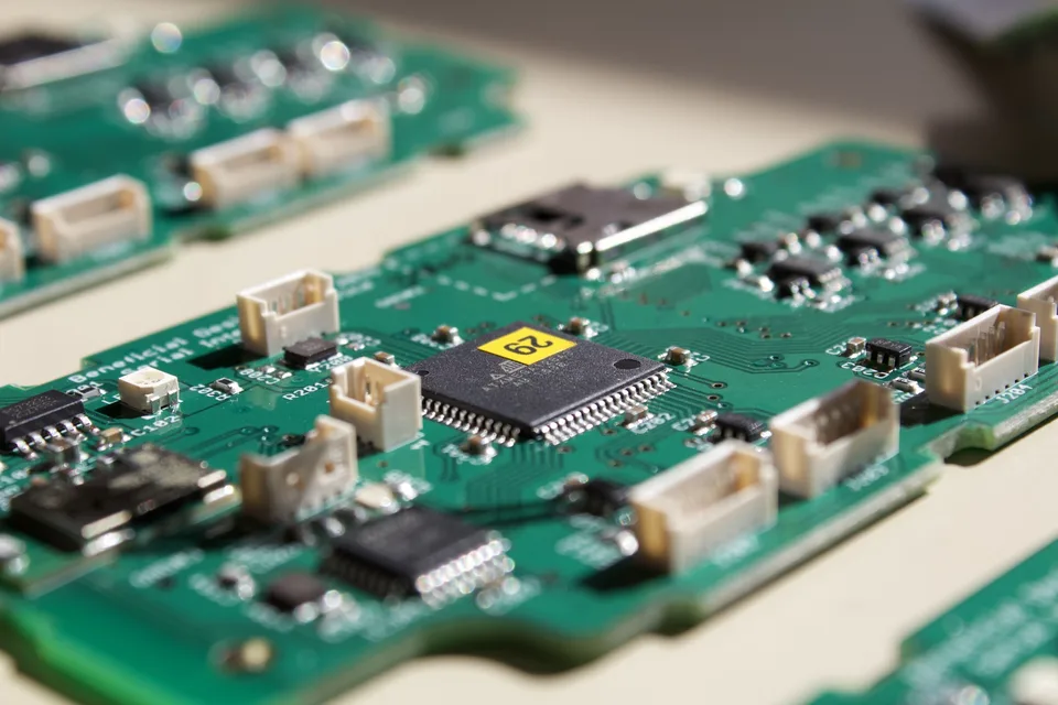 A populated circuit board with a microcontroller and several connectors